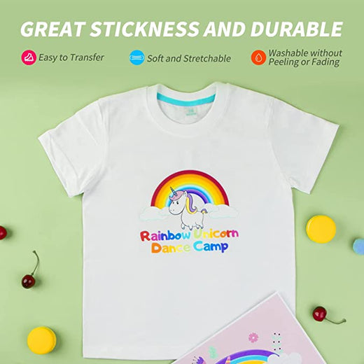 White t-shirt with rainbow unicorn design and text on a green background