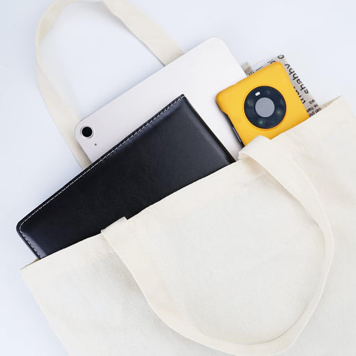 White pouch with black phone case, yellow camera, and white phone inside on a light gray background